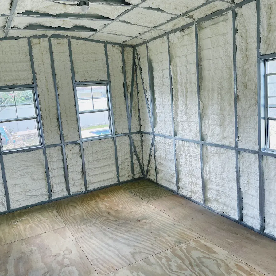 Closed-cell spray foam insulation applied to wall cavities in a residential project in Stanton